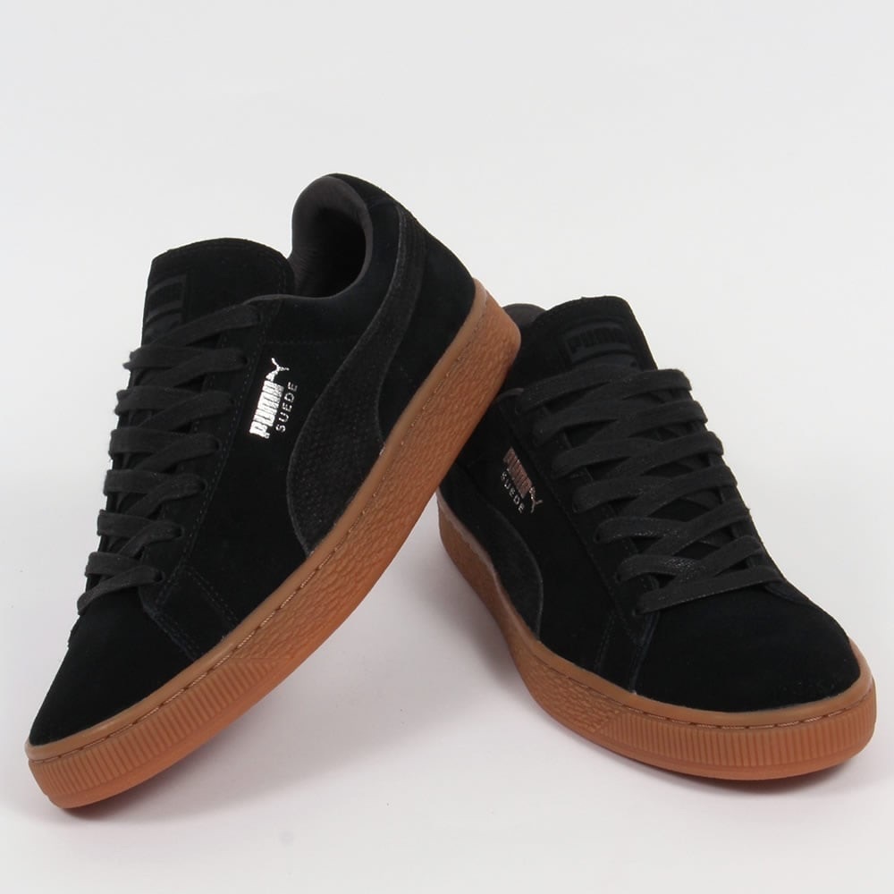 Puma black suede with gold accents size 8.5